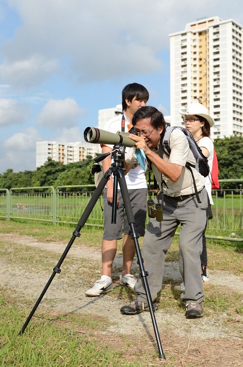 Photographer with Large Lens